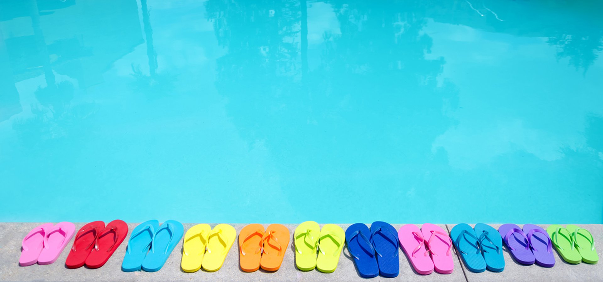 color flip flops by the pool